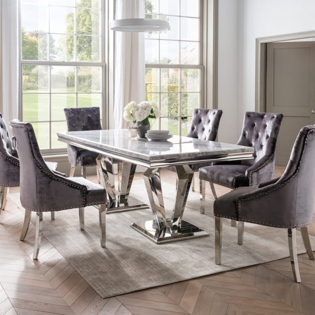 lavish_ Elegant dining room with furniture including an Arturo 180cm Marble Dining Table, tufted chairs, and large windows.