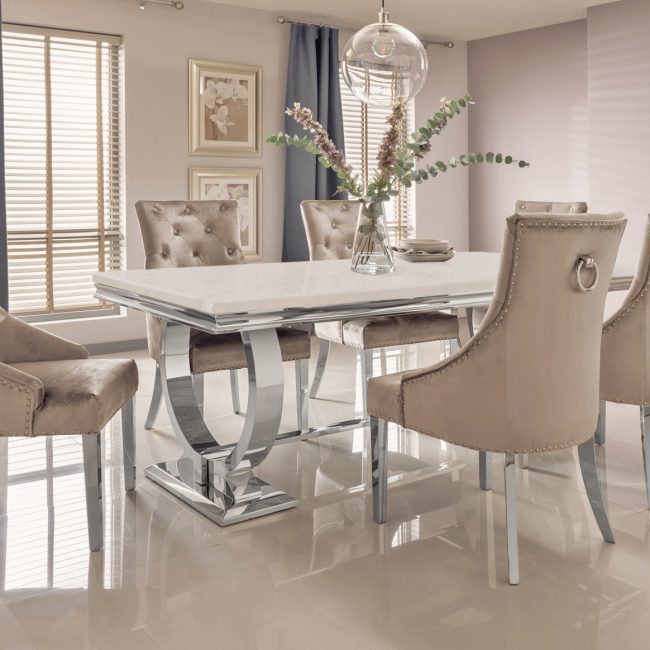 lavish_ Modern dining room with elegant table and upholstered chairs in neutral tones, showcasing Southport-inspired interior design.