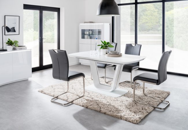 lavish_ Modern dining room with a Lazzaro Dining Table, four chairs, and minimalist home decor.