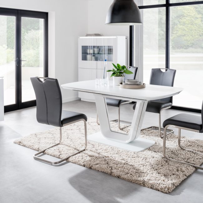 lavish_ Modern dining room with a Lazzaro Dining Table, four chairs, and minimalist home decor.