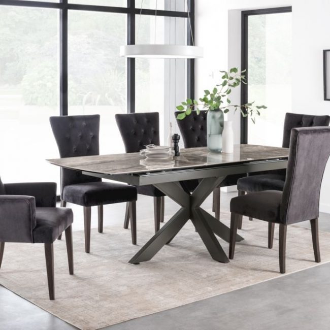 lavish_ Modern dining room with a dark wooden table, six charcoal upholstered chairs, and minimalist Southport home decor.