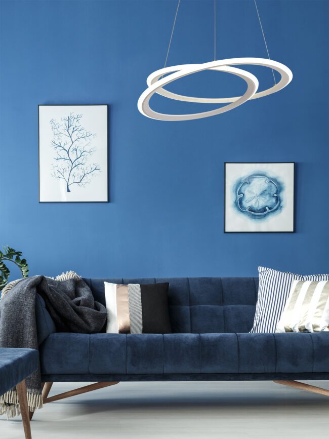 lavish_ Modern living room interior design with blue couch, abstract wall art, and Lord LED Ceiling Light.