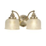 lavish_ Two-light Helena Switched Wall Lamp with an antique brass finish and prismatic glass shades, perfect for enhancing your home decor and interior design.