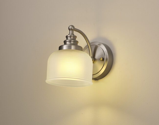 lavish_ Helena Switched Wall Lamp 1 Light E27 Satin Nickel / Frosted Glass with a frosted glass shade turned on, perfect for interior design enhancement.