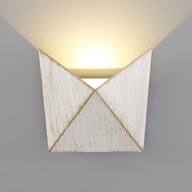 lavish_ Felix Wall Light with a geometric, envelope-like design casting a warm glow, perfect for Southport-inspired home decor.