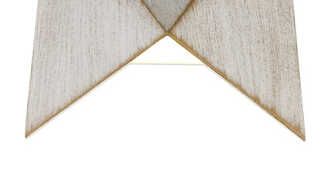 lavish_ Close-up of a cream-colored Felix Wall Light with a golden trim forming a pointed end.