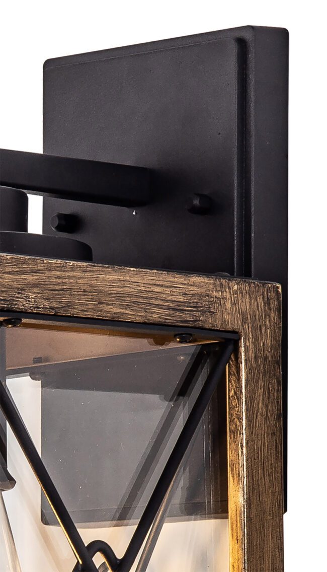 lavish_ Close-up of a Gant Small Wall Lamp with a black metal backplate and a wooden frame around a glass pane.
