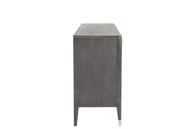 lavish_ A modern Diletta Dressing Chest 7 Drawer - Ebony with tapered legs and brass detailing.