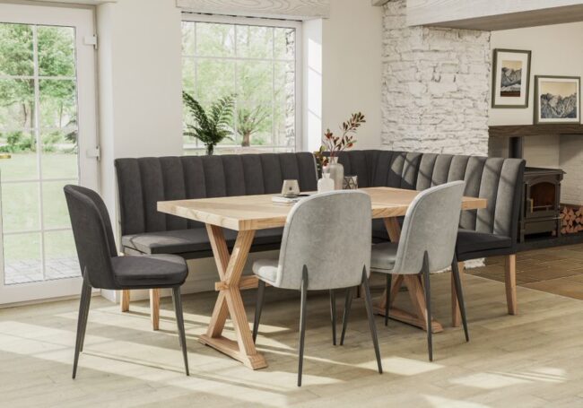 lavish_ Modern dining room with an exquisite selection of furniture, featuring a large wooden table and the Valent Corner Section of Bench 680 in Dark Grey, near a window overlooking a garden.