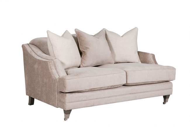 lavish_ Beige loveseat with plush cushions and throw pillows against a white background, perfect for Southport home decor.
