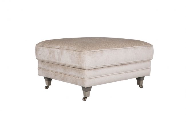 lavish_ Beige upholstered ottoman with caster wheels, perfect for Southport interior design.