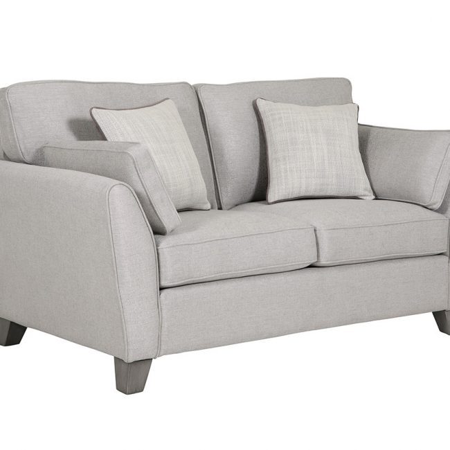 lavish_ A grey fabric loveseat with cushions, a perfect piece of Southport home decor furniture, against a white background.