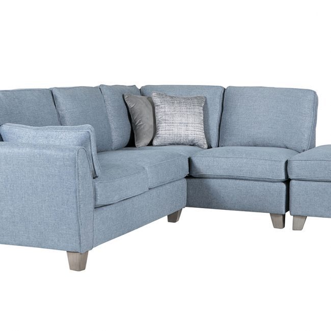 lavish_ Southport blue fabric l-shaped sectional sofa with a matching ottoman.