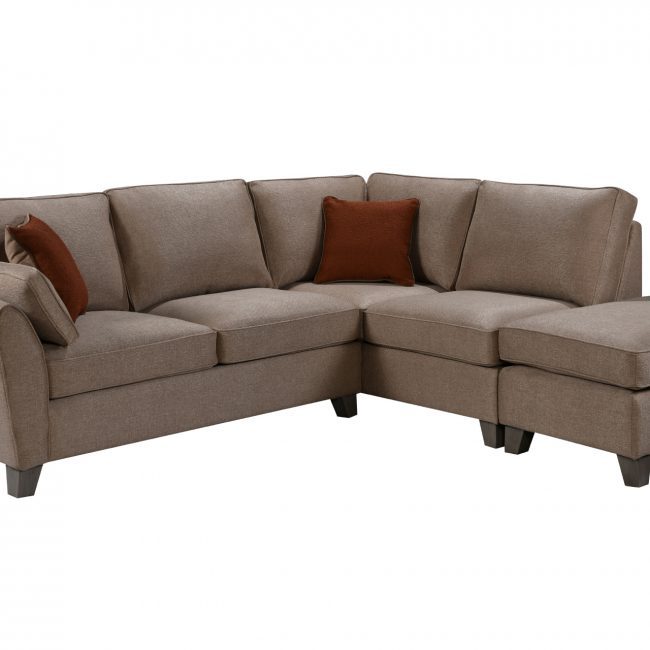 lavish_ L-shaped sectional sofa with tan upholstery, throw pillows, and Southport-inspired home decor.