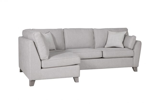 lavish_ Modern light gray sectional sofa with cushions on a white background, perfect for Southport interior design.