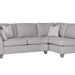 lavish_ A grey sectional sofa with cushions against a white background, perfect for enhancing your home decor.
