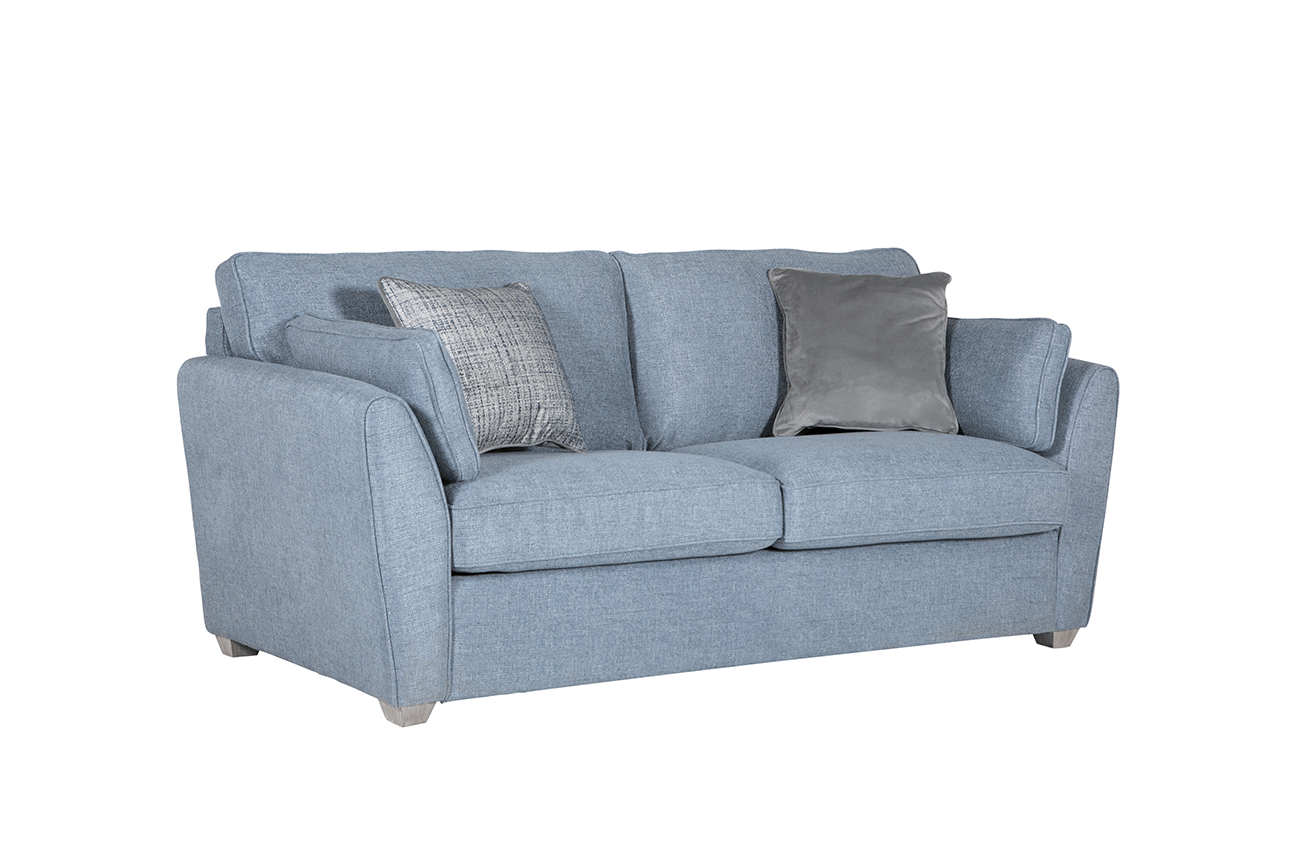 lavish_ A blue fabric sofa with cushions, ideal for home decor, against a white background.
