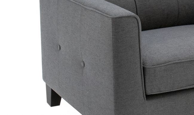 lavish_ Close-up view of an Astrid 1 Seater Sofa Charcoal with visible stitching and cushion detail, perfect for your Southport home decor needs.