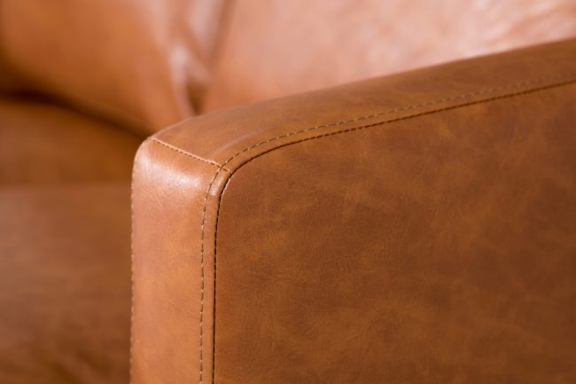 lavish_ Close-up of a Jasper 3 Seater Sofa - Tan with visible stitching, perfect for Southport-themed home decor.