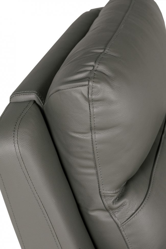 lavish_ Close-up view of a black leather sofa cushion with visible stitching, perfect for Southport home decor.