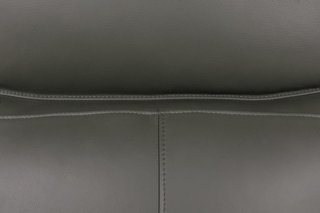 lavish_ Close-up view of black leather texture with stitching detail, perfect for Southport interior design.
