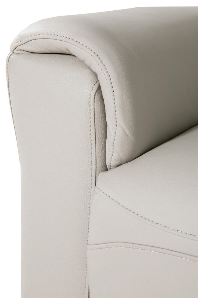 lavish_ Close-up of a cream-colored leather sofa armrest with detailed stitching, perfect for Southport interior design aesthetics.