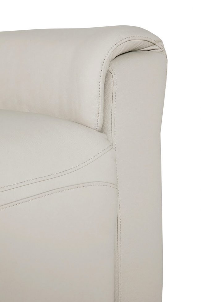 lavish_ Close-up of a beige leather sofa armrest with detailed stitching, a perfect piece of furniture for home decor.