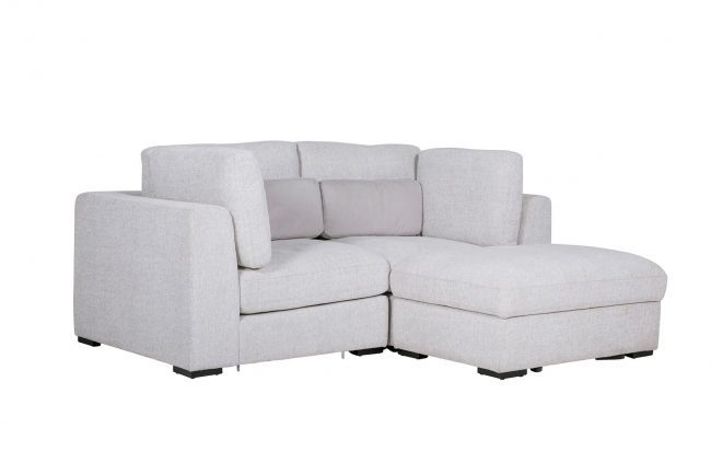 lavish_ Light grey sectional sofa with chaise lounge and cushions against a white background.