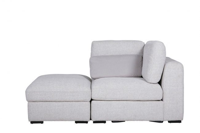 lavish_ A gray sectional sofa with a Humphrey Storage Ottoman Light Grey on a white background.