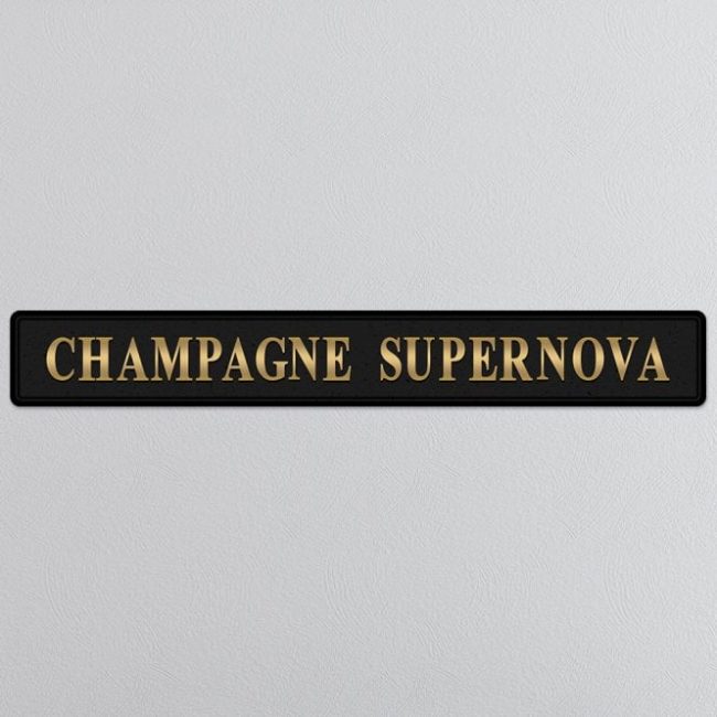lavish_ Black plaque with gold lettering reading "Champagne Supernova Gold Foiled Sign Made of MDF 3D gold foil lettering Superior quality Not suitable for outdoor use in all weather.