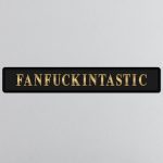 lavish_ A plaque with the word "fanfuckintastic" on a BLACK FANF**KINTASTIC GOLD FOILED SIGN.