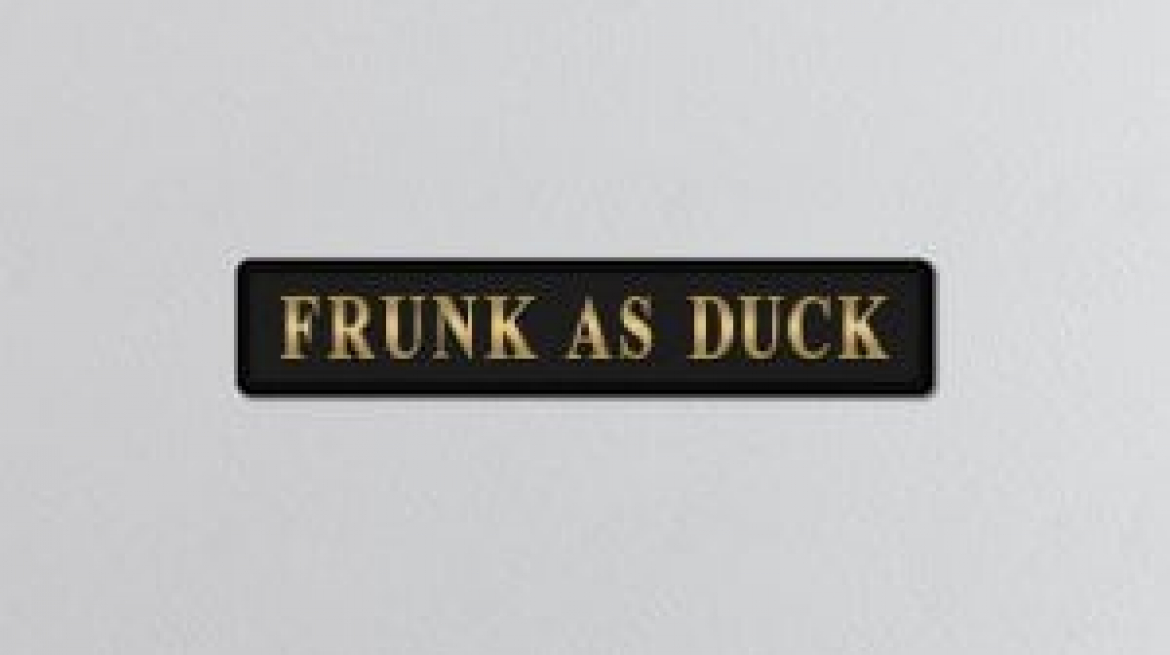lavish_ A black frunk as duck gold foiled sign with the phrase "frunk as duck" in white block letters.