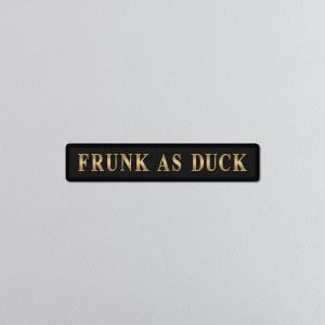 lavish_ A black frunk as duck gold foiled sign with the phrase "frunk as duck" in white block letters.