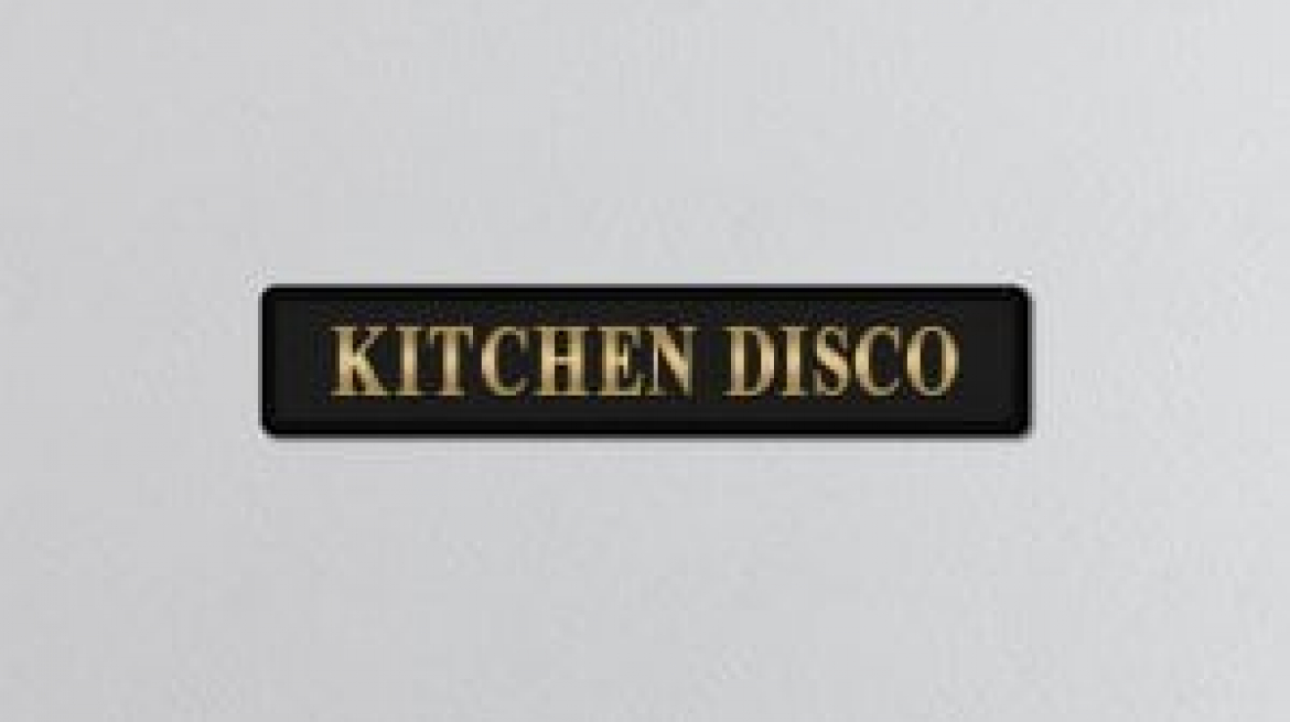lavish_ A BLACK KITCHEN DISCO GOLD FOILED SIGN mounted on a white wall.